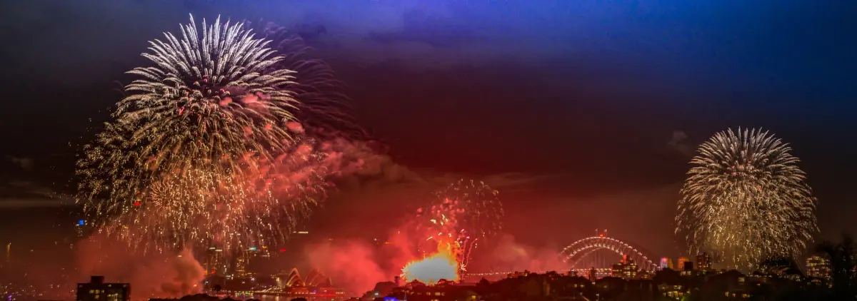 Red fireworks over the harbour on New Year's Eve